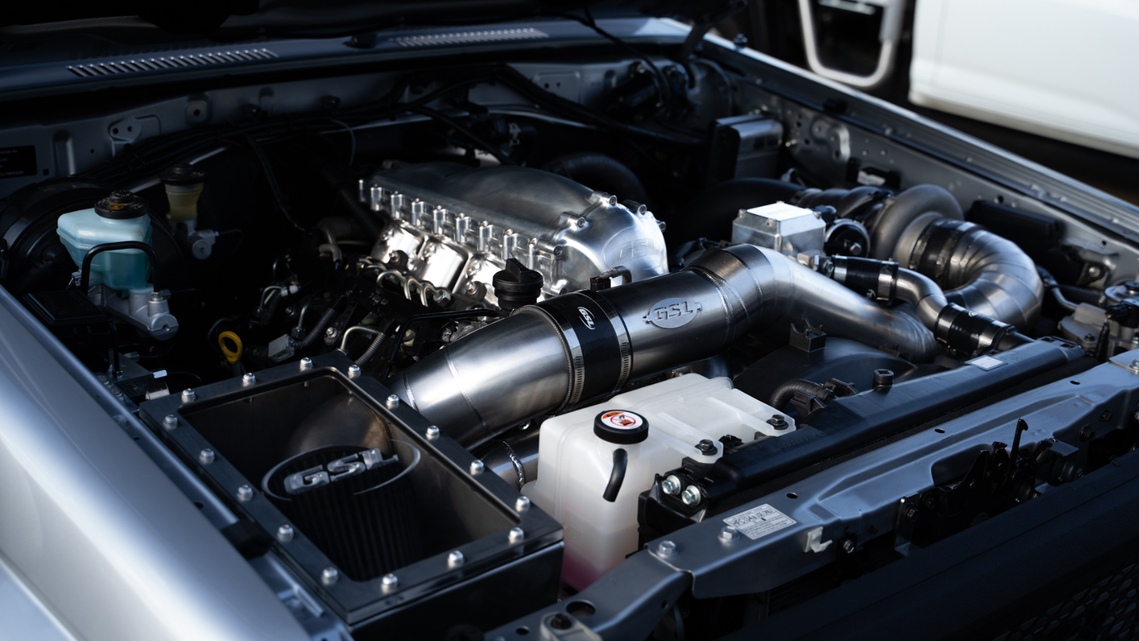 landcruiser engine bay with stainless airbox and intake